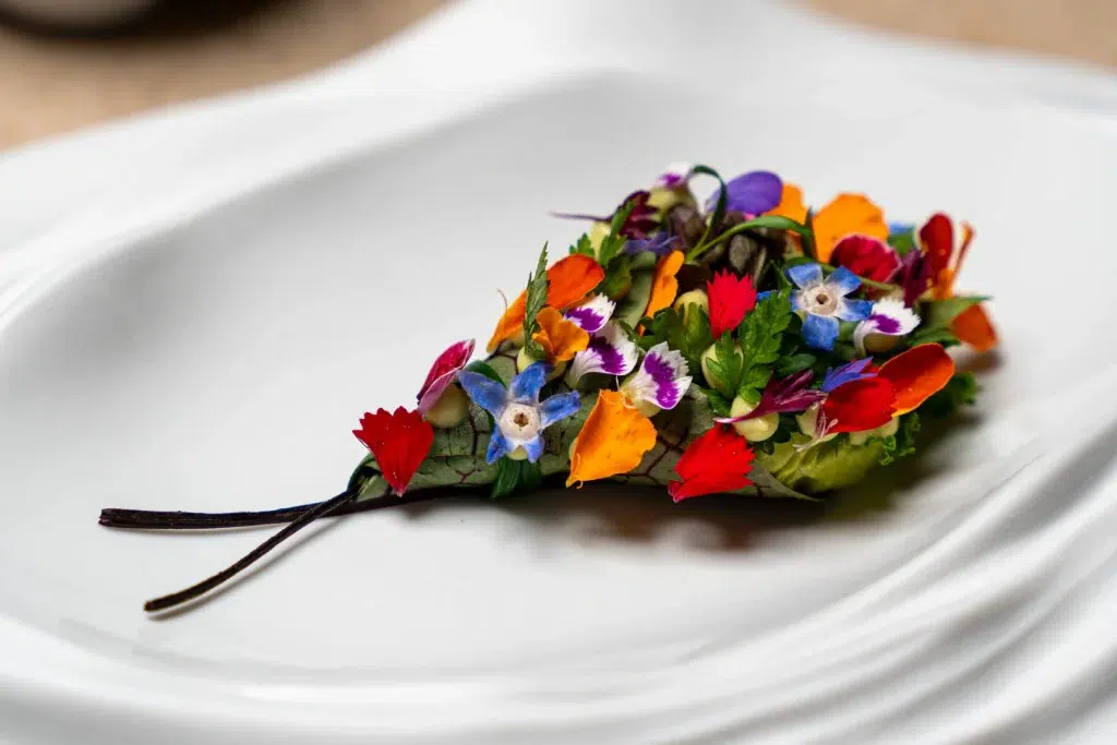 The final dish: a collection of leaves, herbs and flowers, composed like a gift. - The Bouquet From the Farm